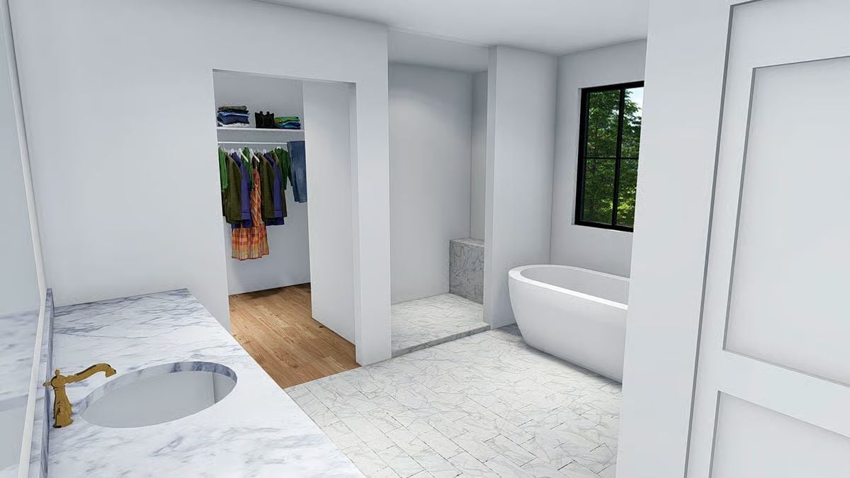 Marble Floors, a Soaking Tub, and Direct Closet Access Make This Primary Bath Work Hard