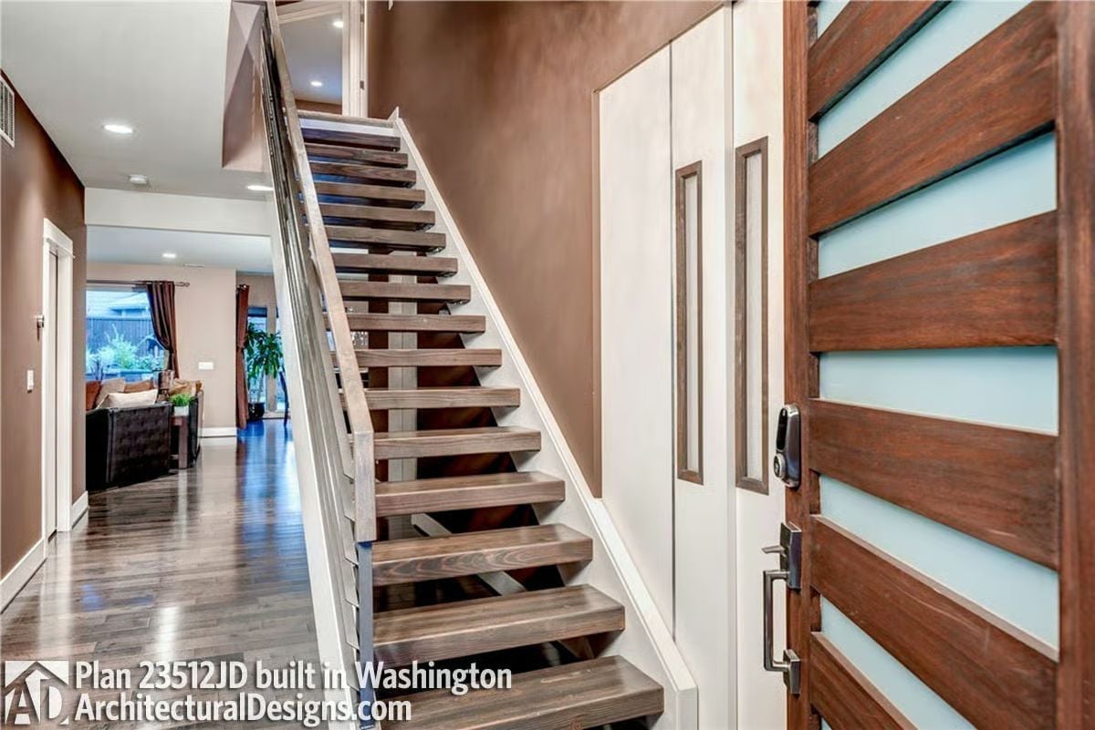 Open-Riser Staircase Anchors an Entry That Means Business