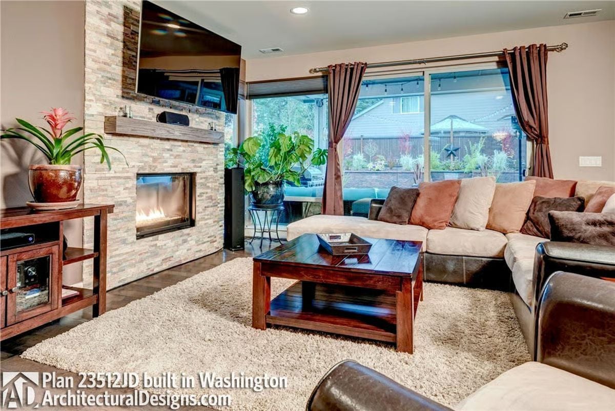 Stone Fireplace Wall Pulls Double Duty as TV Mount and Hearth