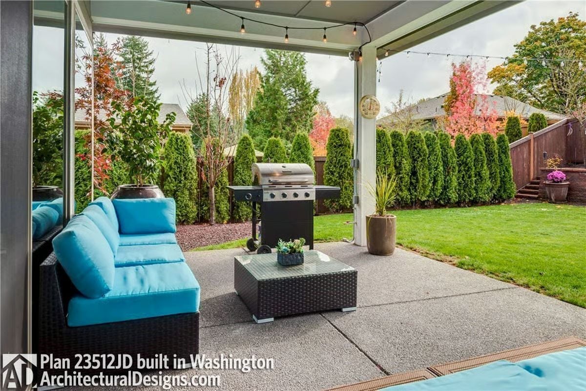 String Lights and Teal Cushions Turn a Covered Patio Into a Backyard Room Worth Staying In