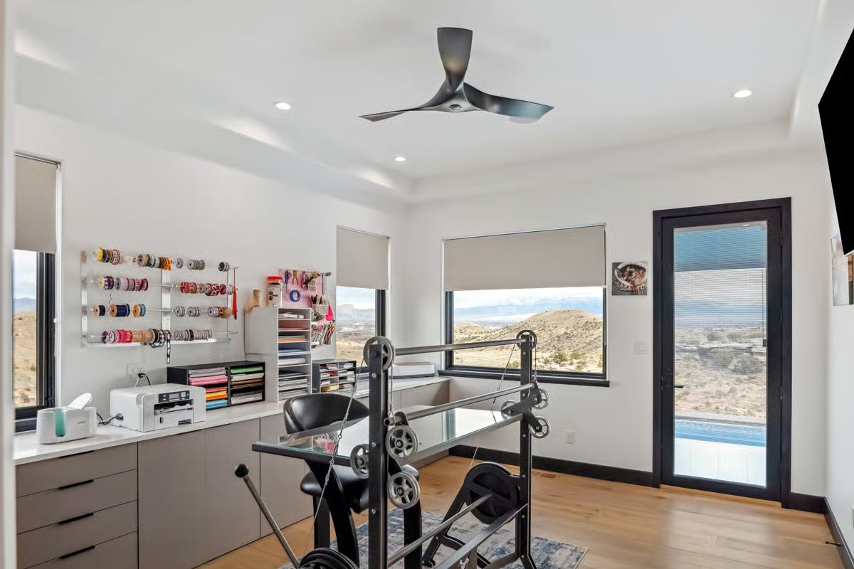 Ribbon Spools, Cable Machine, and Desert Hills Through Every Window