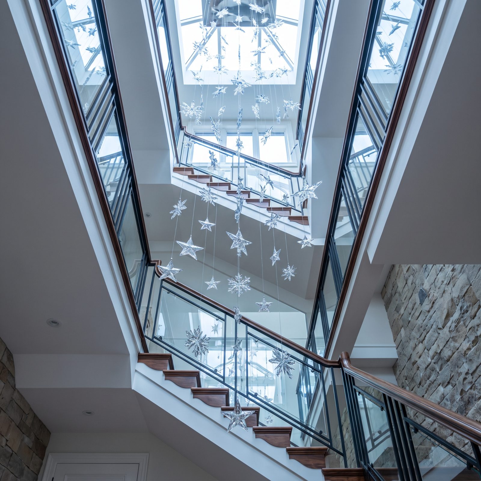 A Stairwell Filled With Descending Stars and Snowflakes
