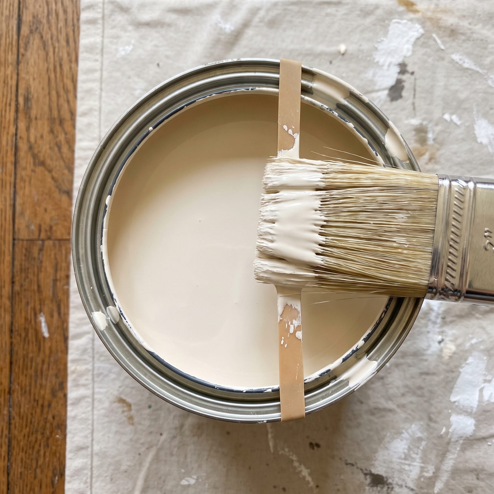 Stretch a Rubber Band Across the Paint Can to Wipe Your Brush Clean