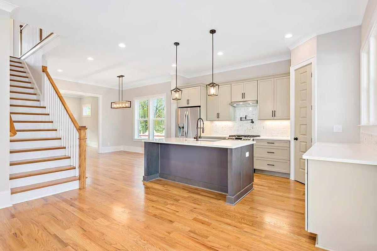 Gray Island Base Against Light Hardwood Makes a Strong Case for Contrast