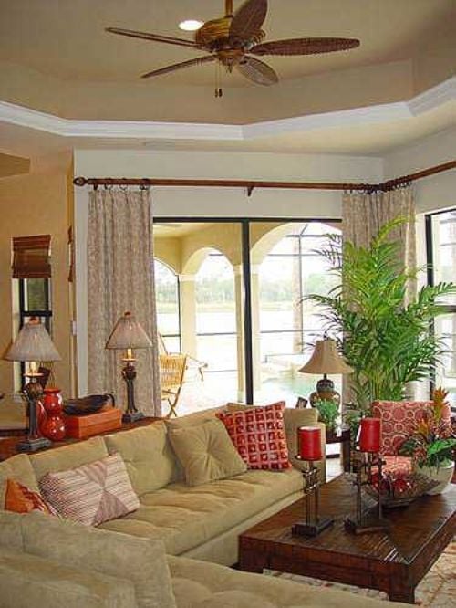 Lanai Light and Red Pillows Make the Living Room Feel Like a Permanent Vacation
