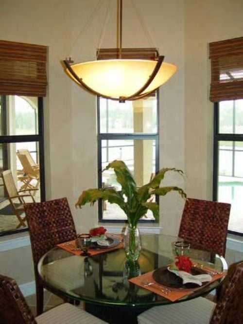 Rattan, Glass, and a Single Pendant Turn Dinner Into an Event