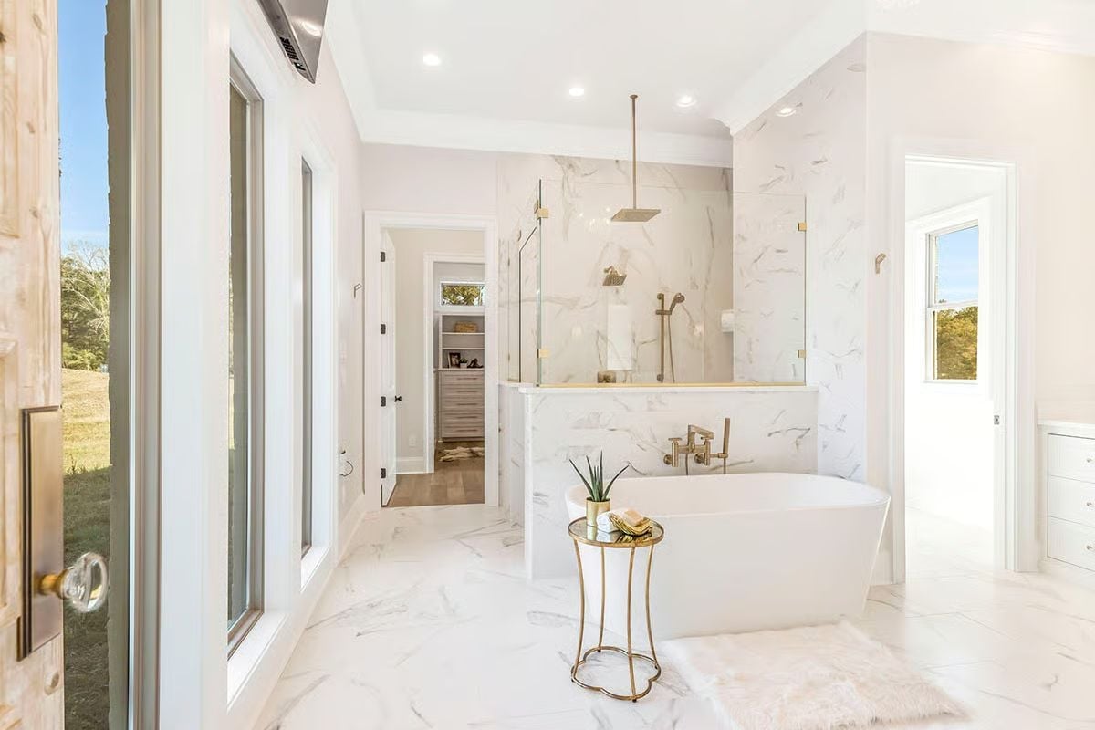 Calacatta Marble, a Soaking Tub, and Gold Fixtures That Don't Try Too Hard
