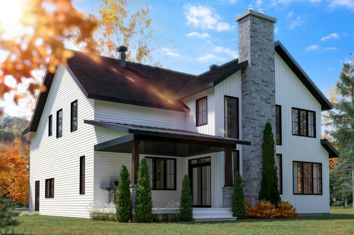 Stone Chimney, Dark Trim, and a Covered Porch That Earns Its Keep