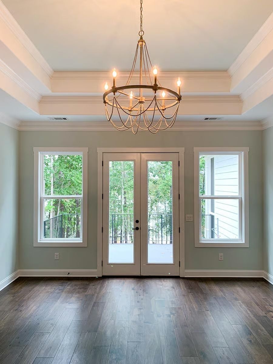 Beaded Chandelier and French Doors Make a Case for Skipping Window Treatments