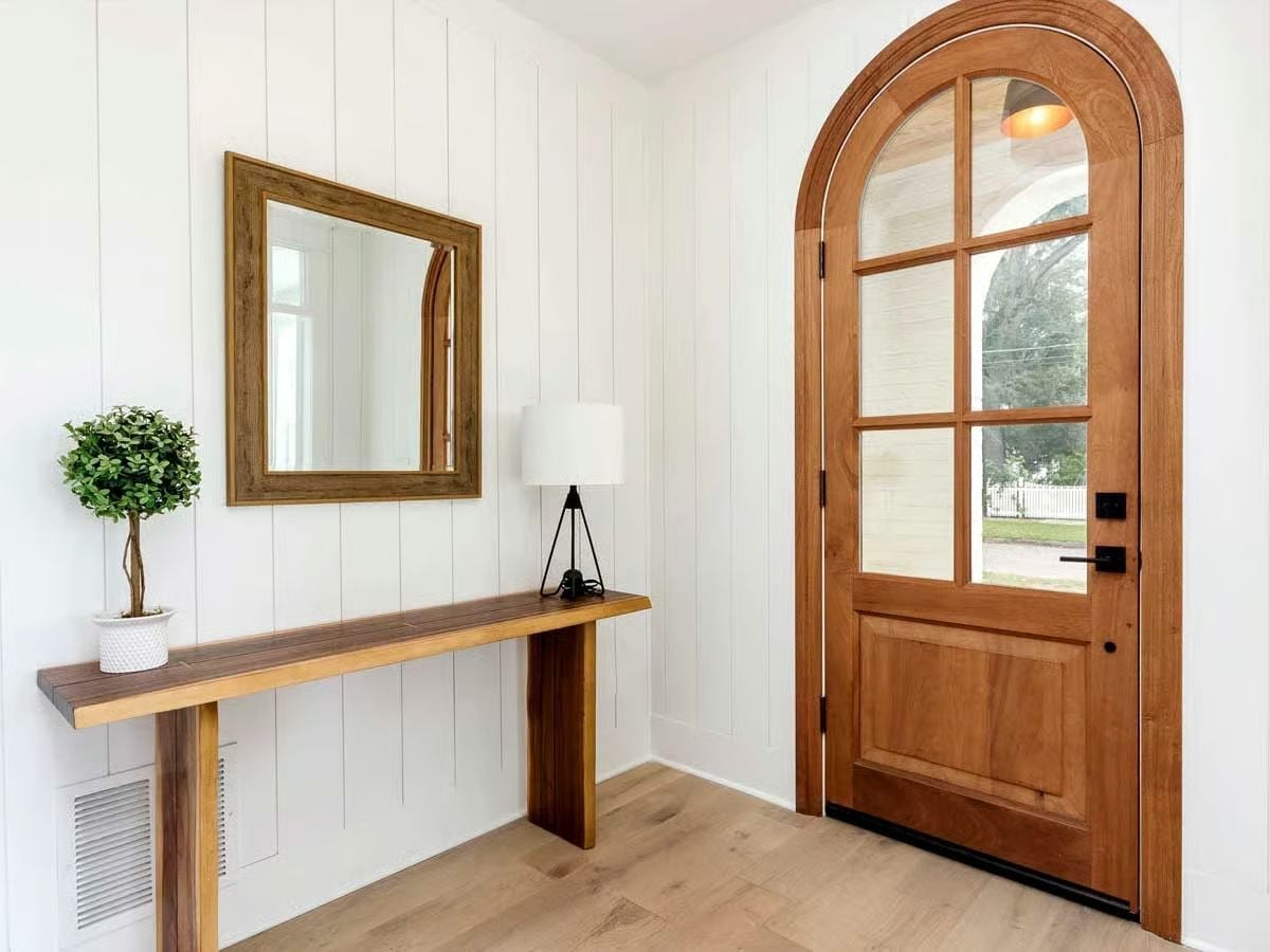 Arched Wood Entry Door Sets the Tone Before You've Crossed the Threshold