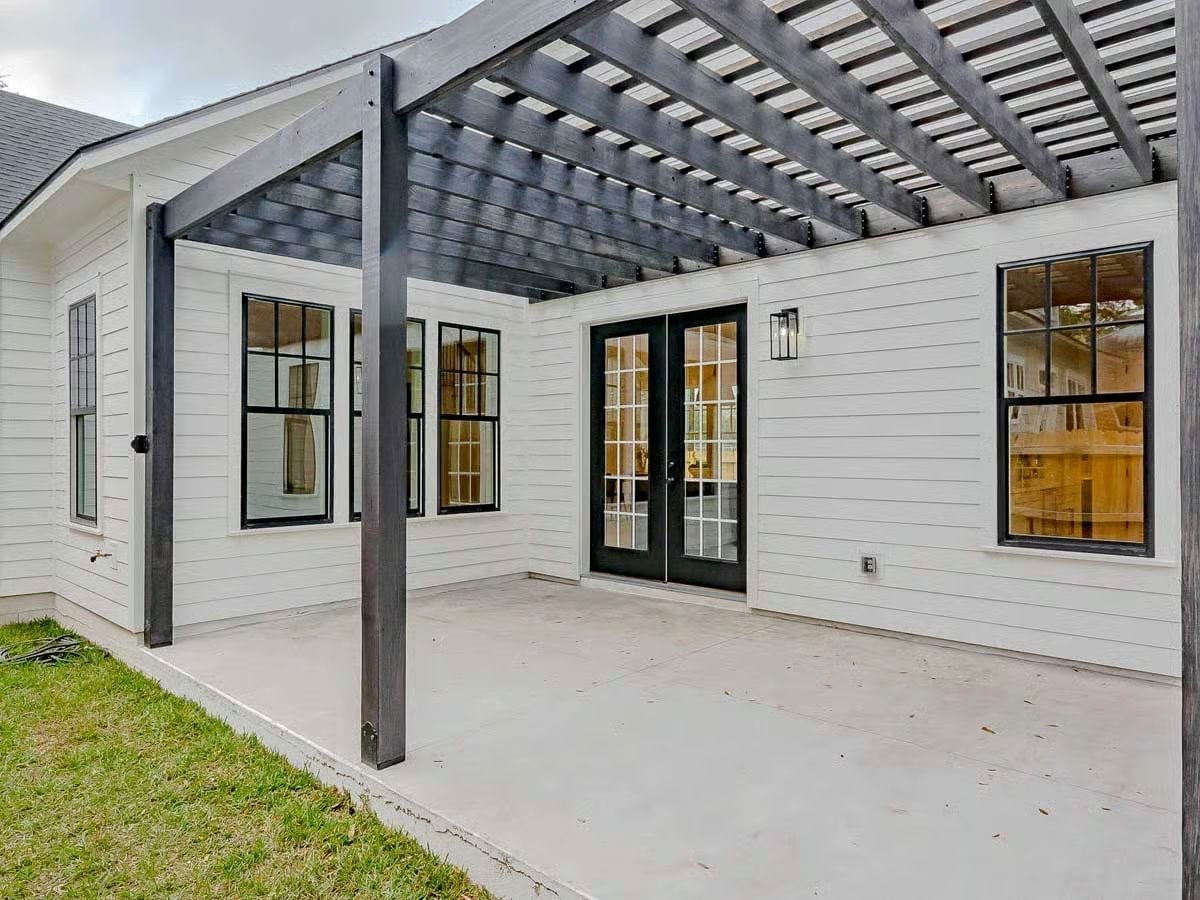 Charcoal Pergola and French Doors Turn a Concrete Patio Into a Real Outdoor Room