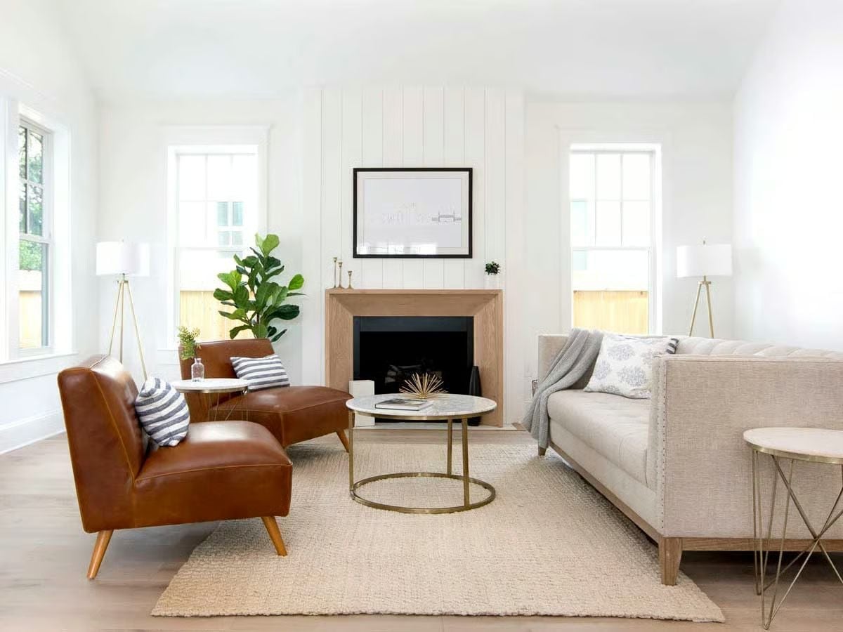 Leather Chairs and a Wood-Surround Fireplace Make the Case for Warm Minimalism