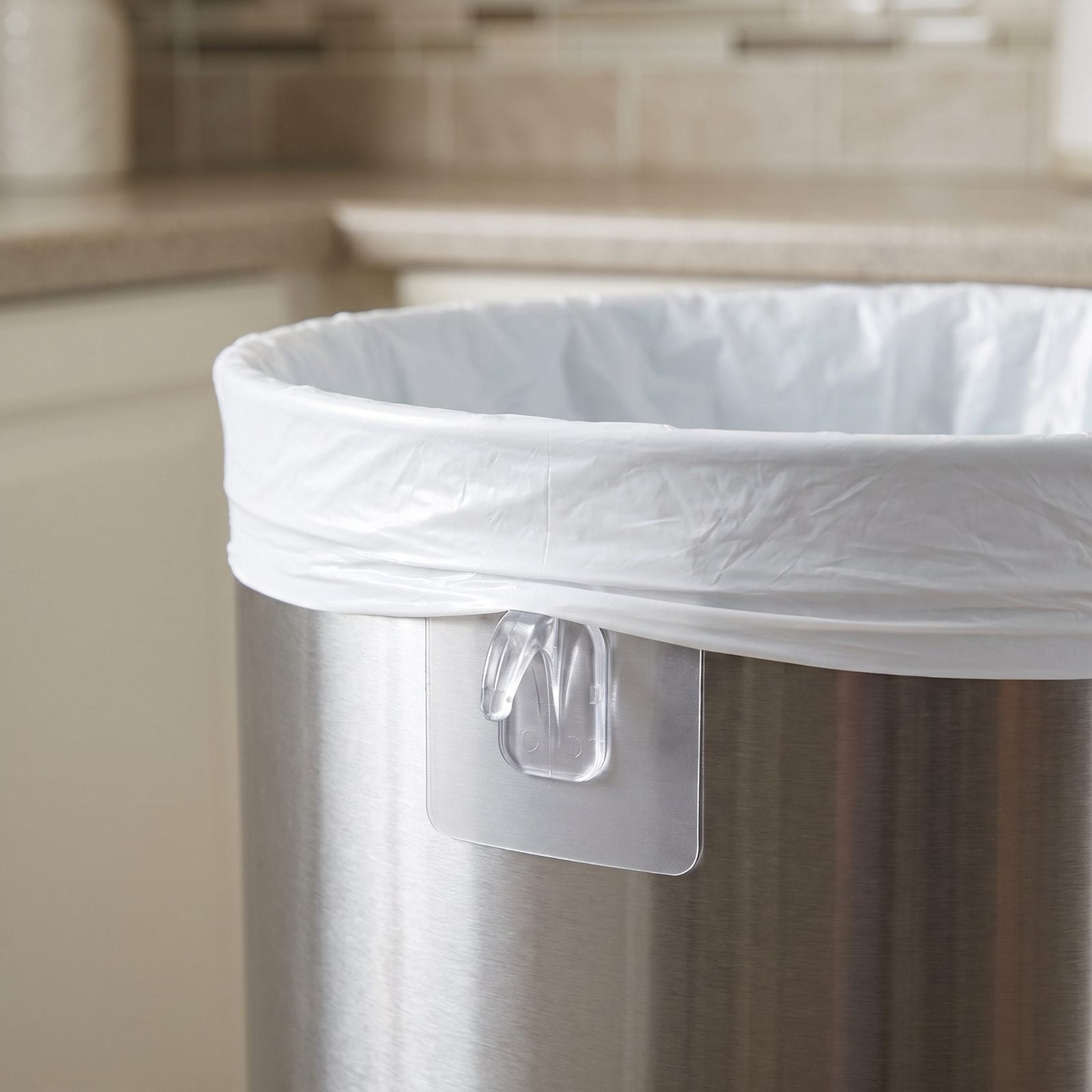 An Upside-Down Hook Keeps the Trash Liner From Slipping