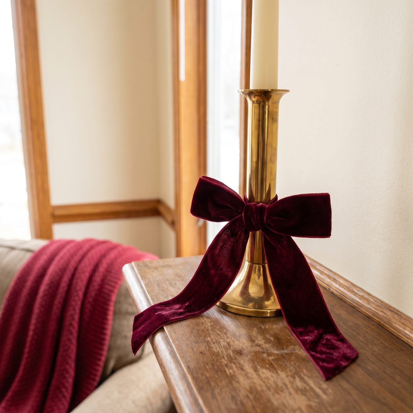 A Velvet Bow Tied to the Base of a Candlestick