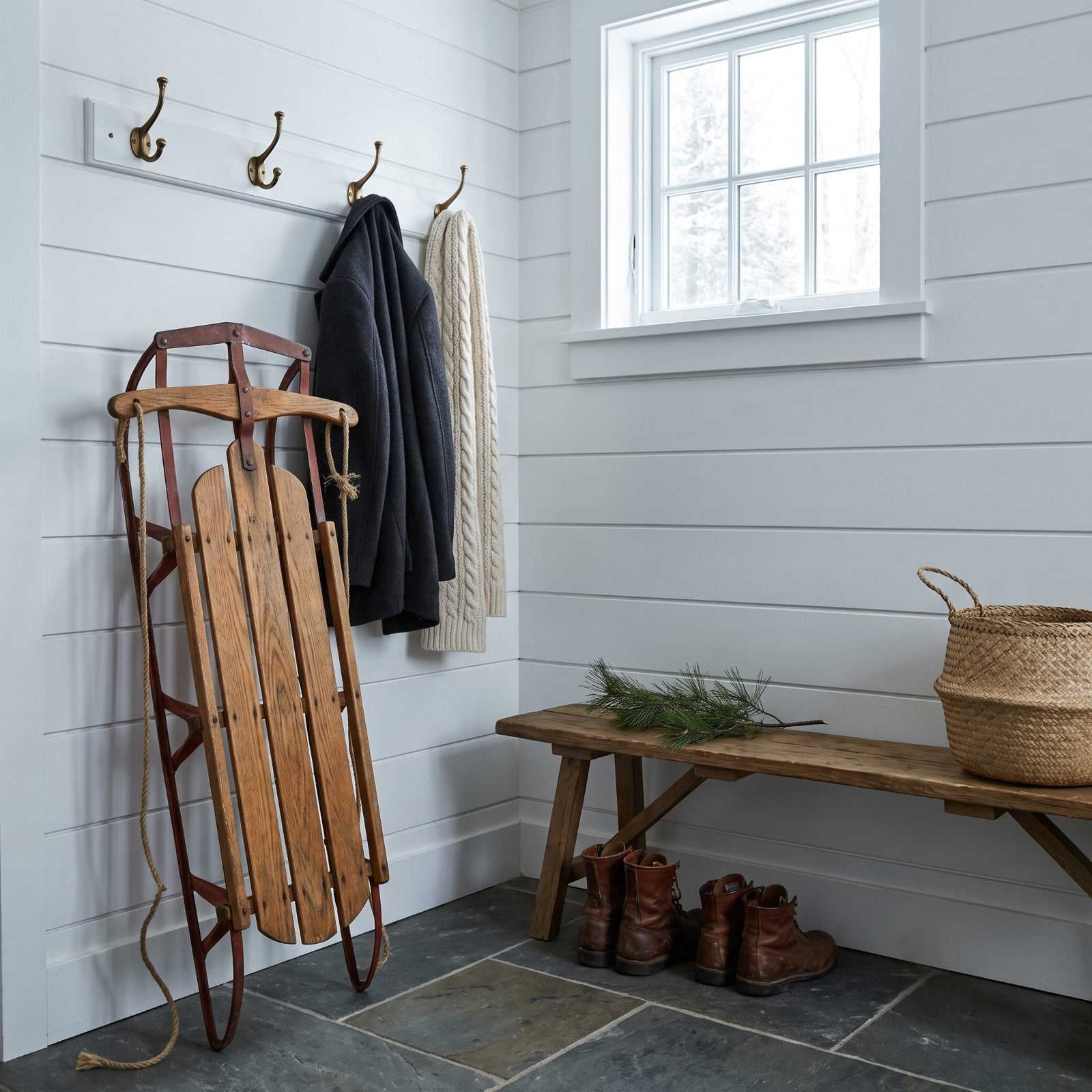 A Vintage Sled Leaning Casually in the Mudroom