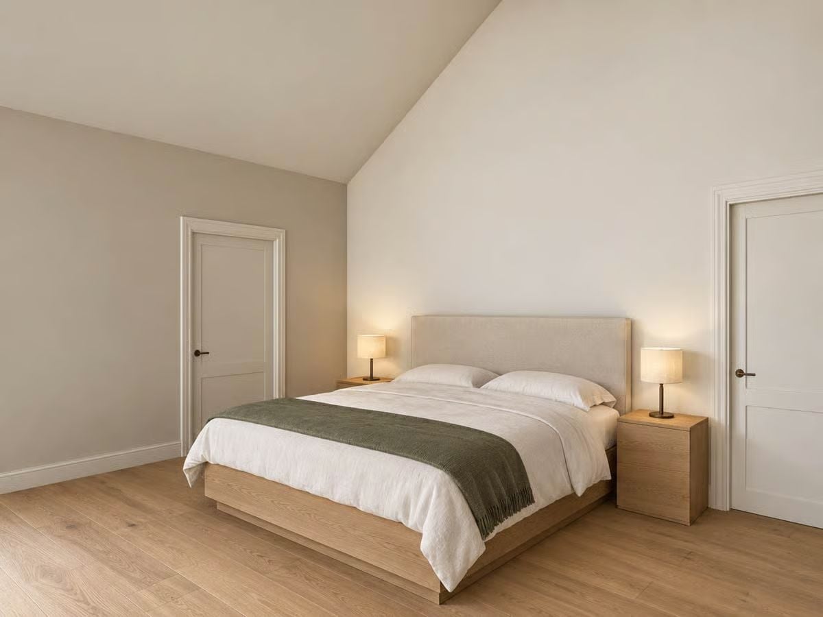 Vaulted Ceiling, Linen Headboard, and Bedside Lamps That Actually Do Their Job