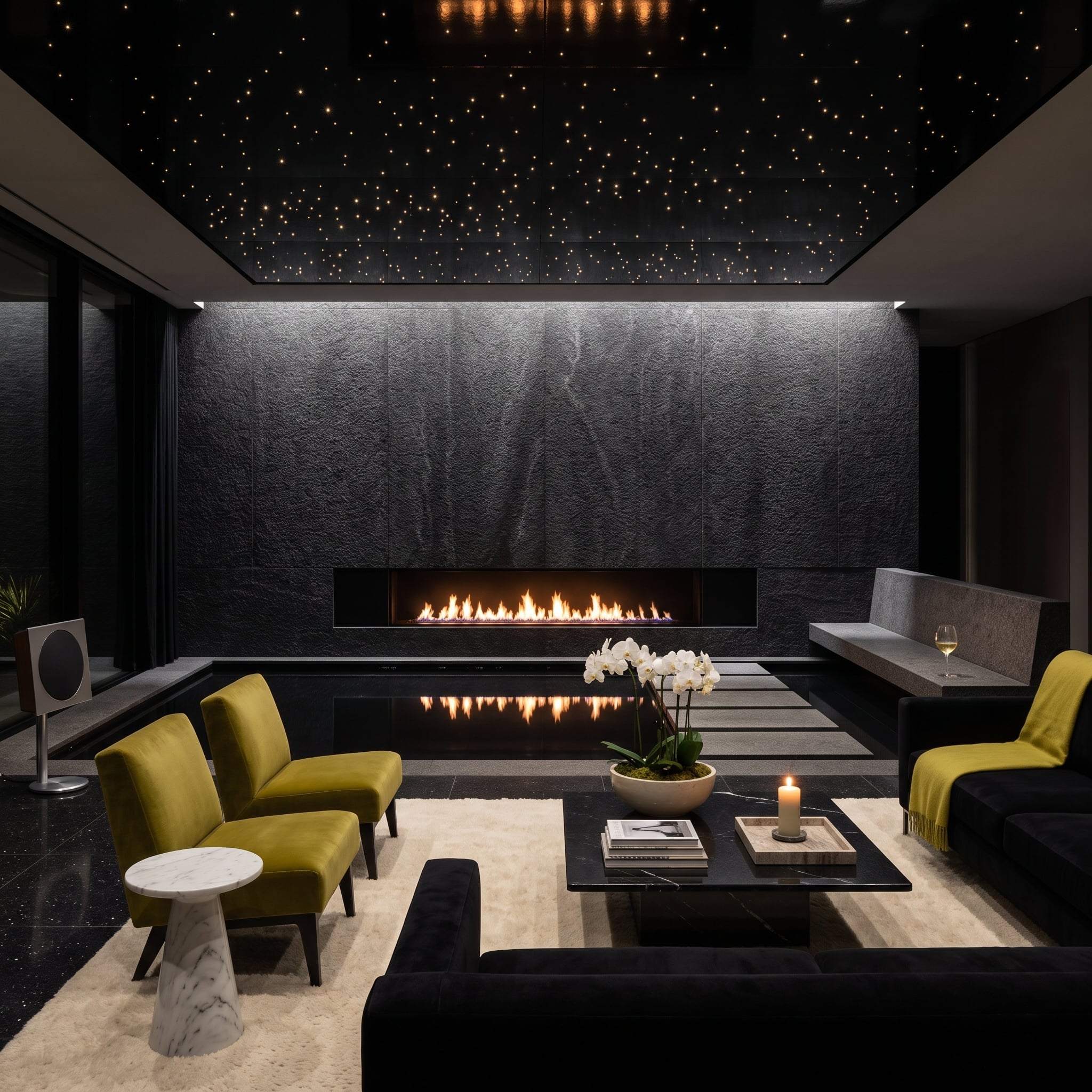 Black slate fireplace wall beneath a fiber-optic star ceiling
