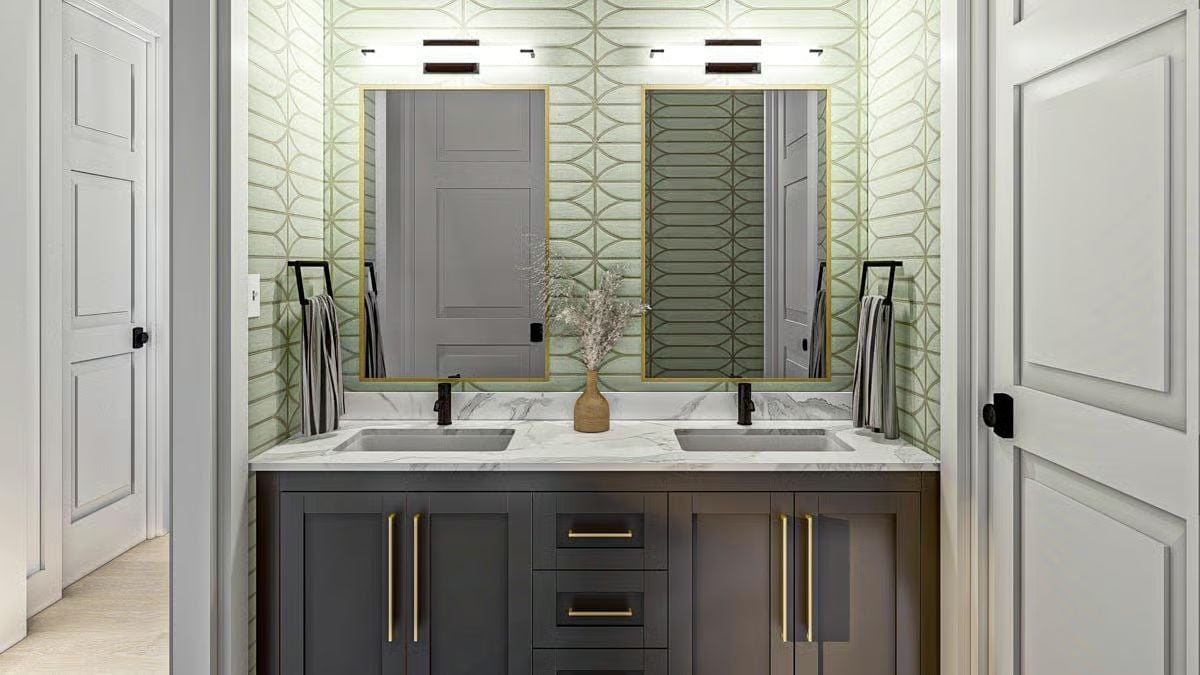 Gold-Framed Mirrors, Matte Black Faucets, and Wallpaper That Holds Its Own