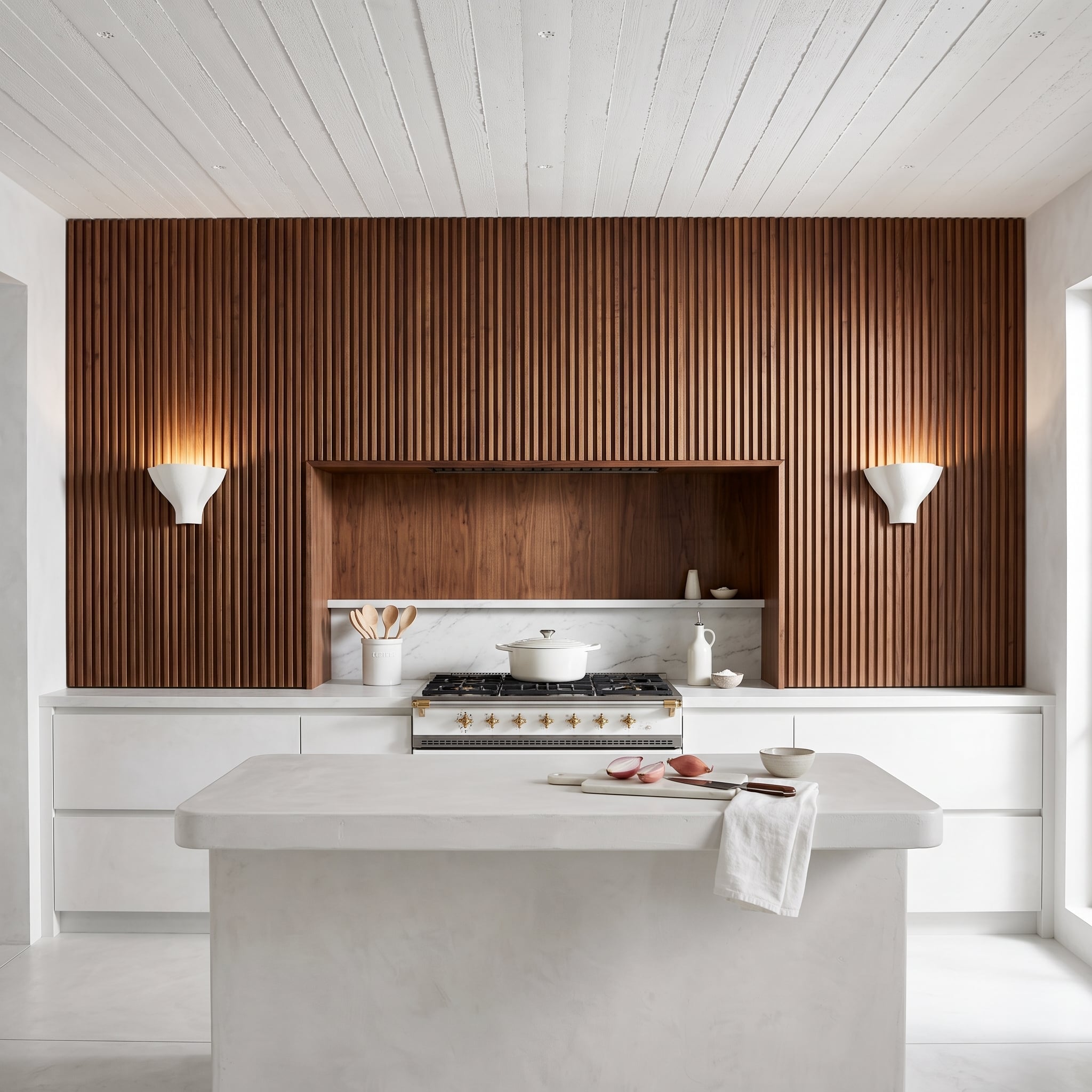 Vertical Walnut Slat Wall Wrapping the Range Proves Texture Carries More Weight Than Color