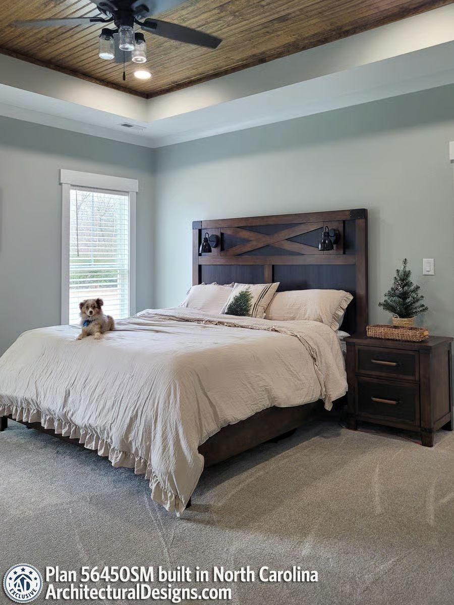 Barn-Door Headboard and a Wood Ceiling That Pull the Room Together Without Trying