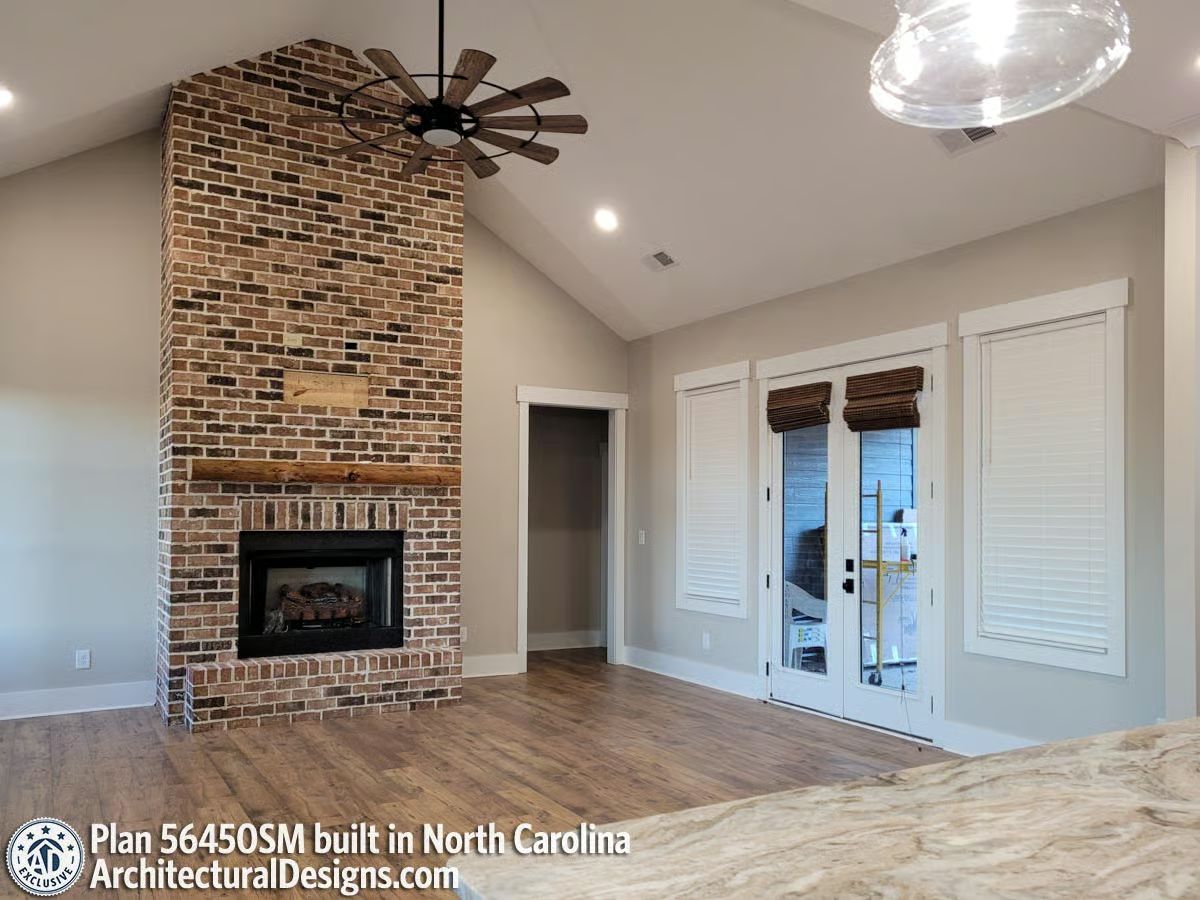 Floor-to-Ceiling Brick and a Raw Wood Mantel That Actually Earns the Room