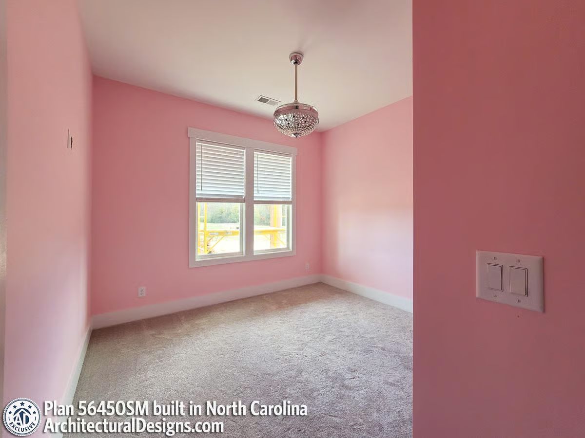 Pink Walls Done Seriously, With a Crystal Fixture That Earns Its Place