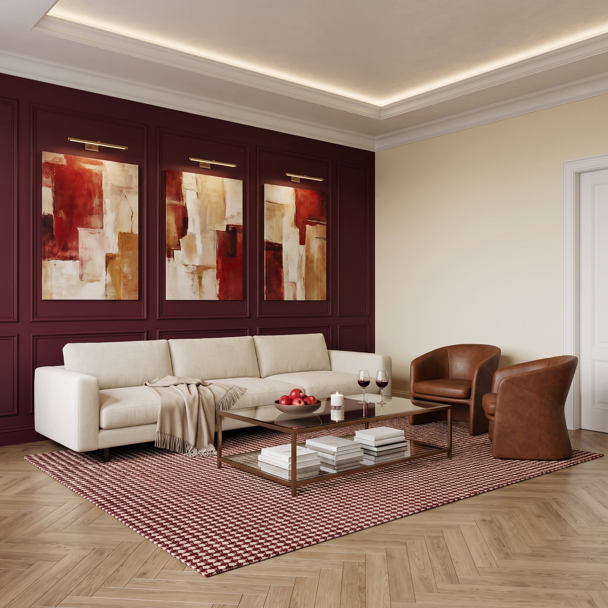 Deep burgundy paneled living room wall with three abstract canvases and brass picture lights